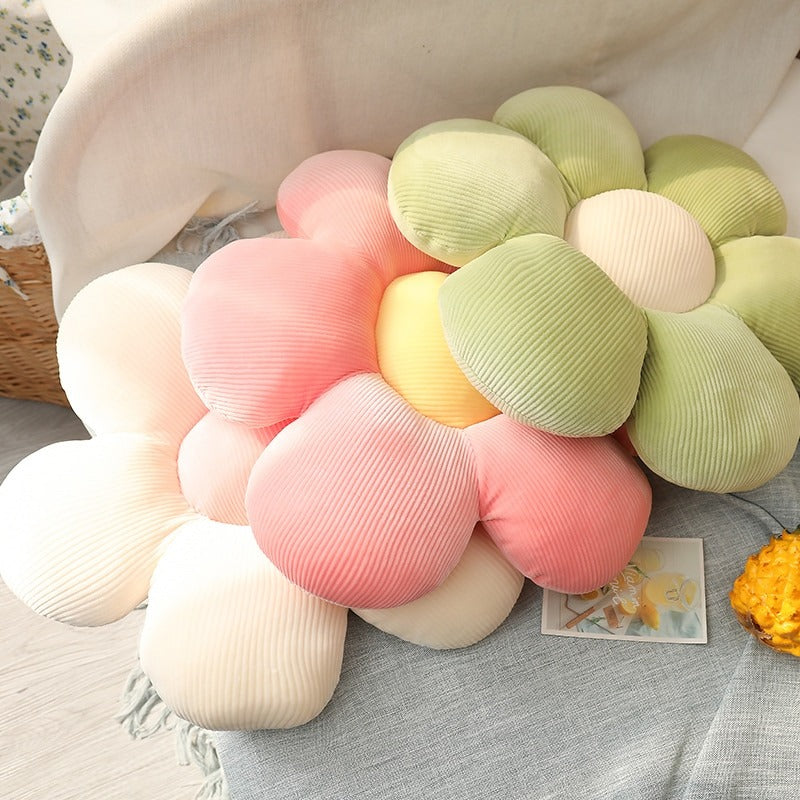 Pastellfarbenes Deko-Kissen in Blumenform
