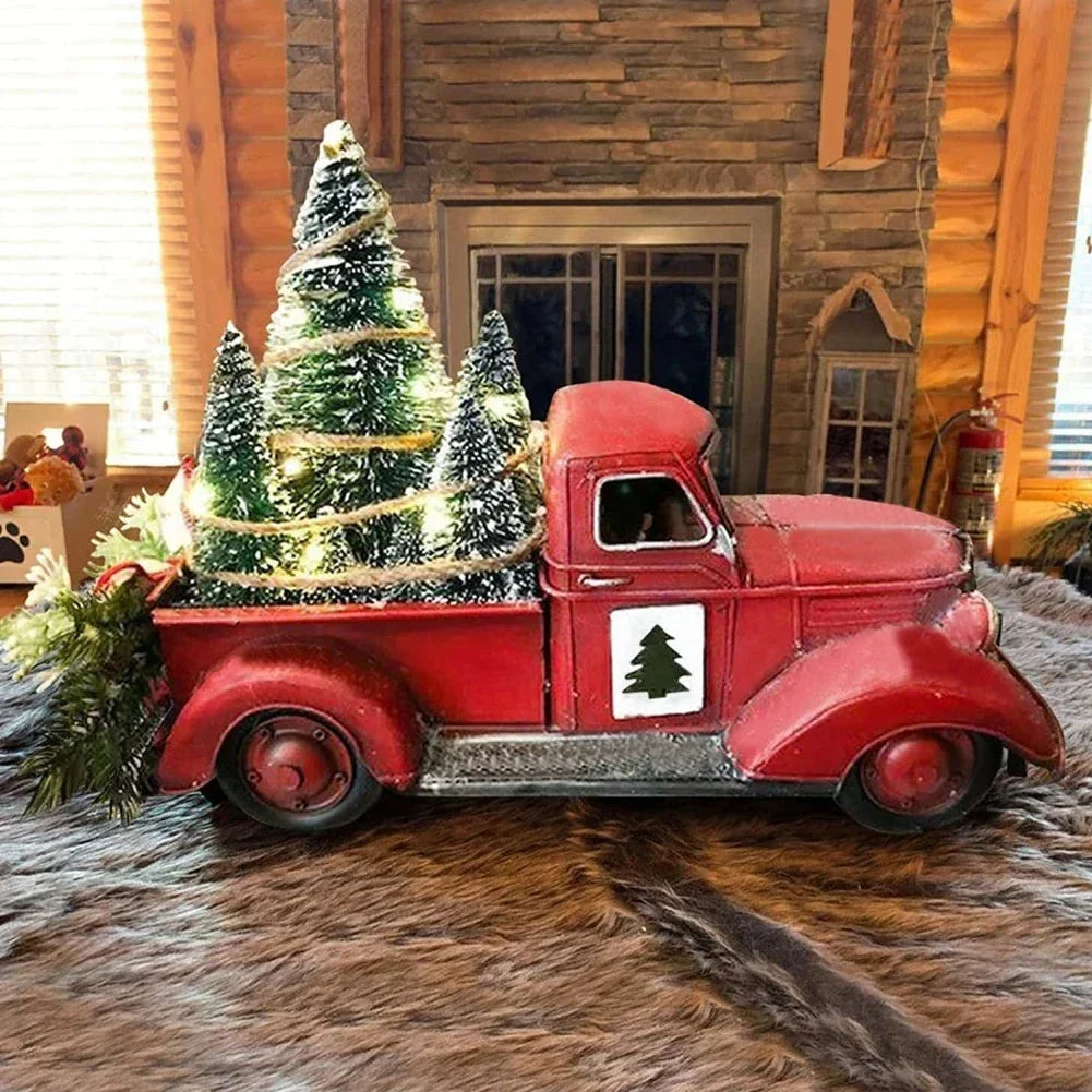 Weihnachtsdekoration roter Truck mit Tannenbäumen und LED-Beleuchtung als Tischdeko